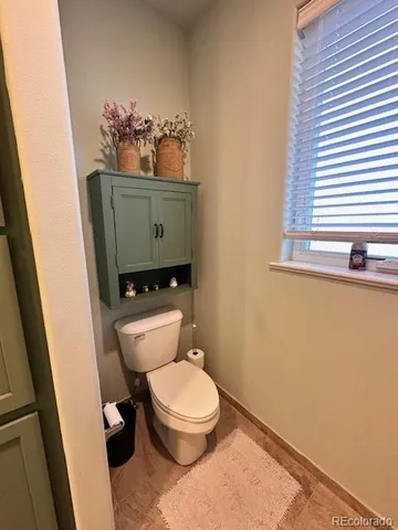 a bathroom with a toilet and a sink