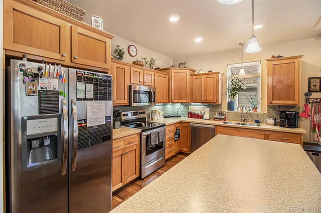 a large kitchen with stainless steel appliances