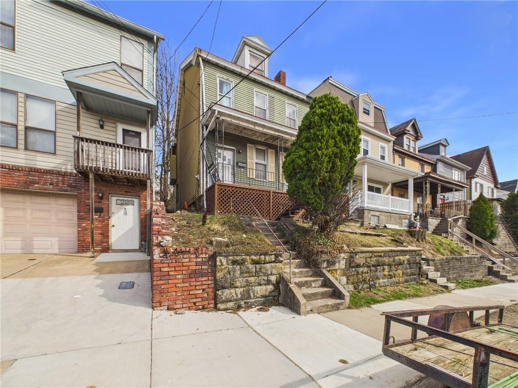 21 Ruth Street Pittsburgh, PA 15211 - Photo 2 of 18 a view of a building with many windows