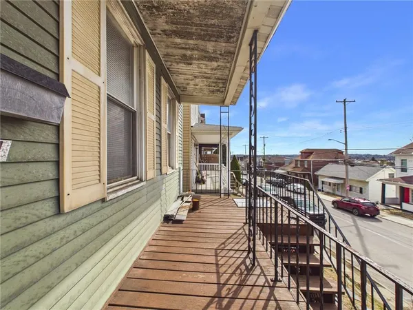 a view of a balcony with chairs