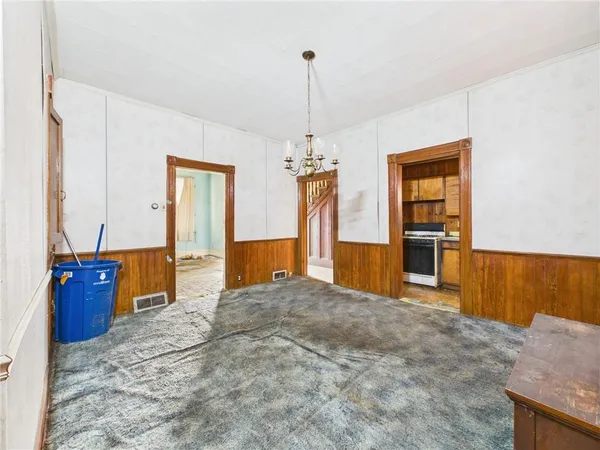 a kitchen with a stove and a table