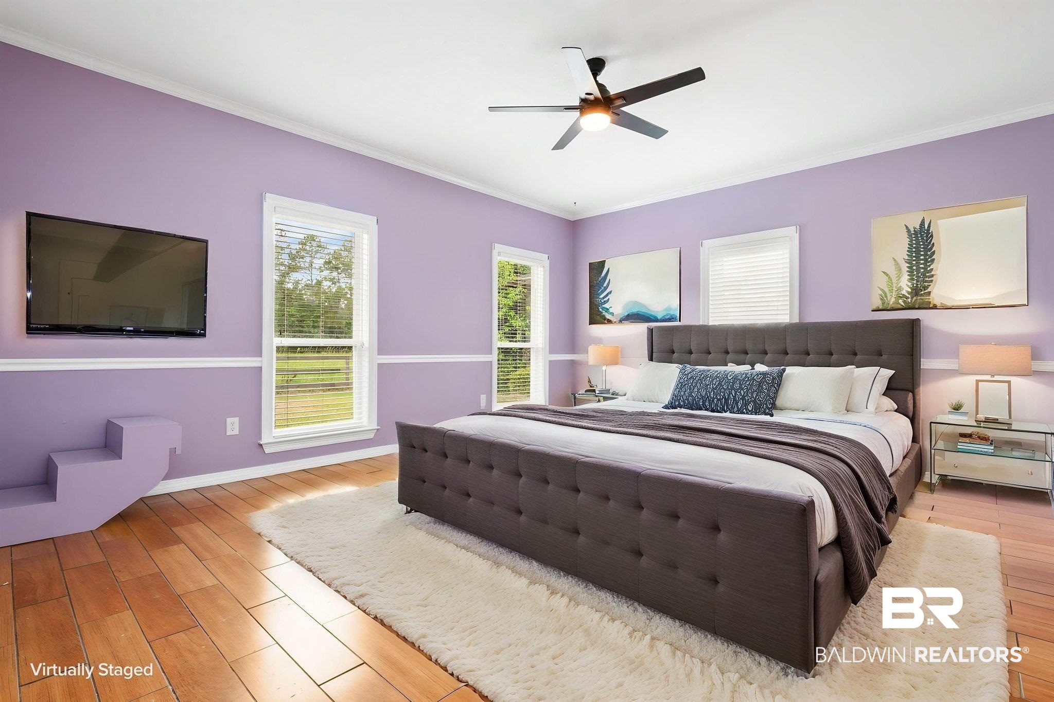 7540 2 Mile Road Irvington, AL 36544 - Photo 10 of 82 Spacious room featuring wood-finish flooring, two large windows with blinds, and a ceiling fan