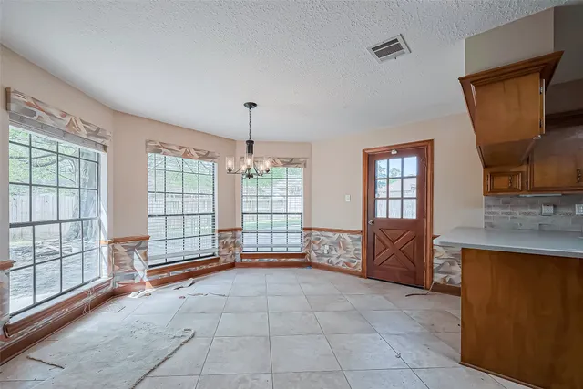 a view of kitchen with granite countertop window and outdoor kitchen