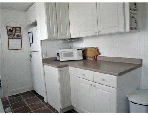 122 Ohio Street Bangor, ME 04401 - Photo 11 of 27 Kitchen. Crisp White Cabinets