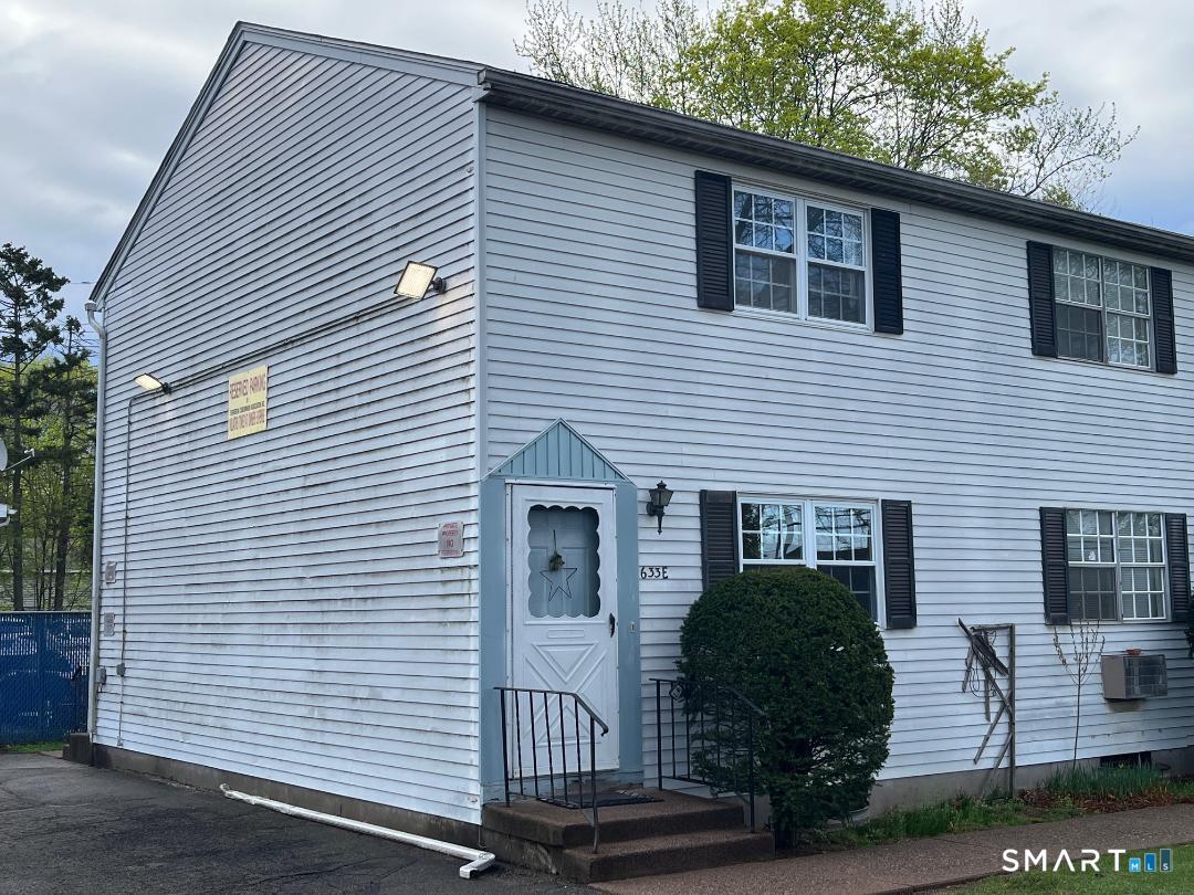 633 Center Street, Unit E Manchester, CT 06040 - Photo 2 of 15 a view of a house with a garage