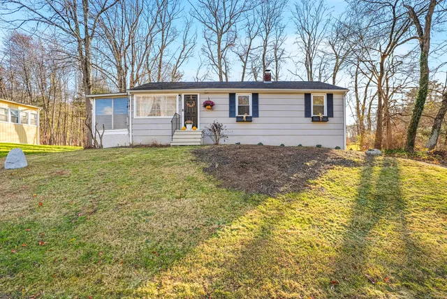 a view of a yard with a house and pool
