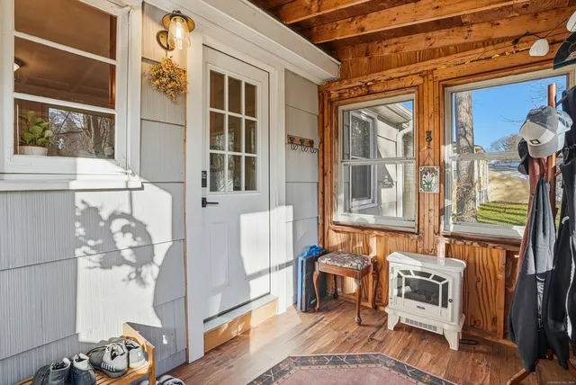 a kitchen with stainless steel appliances granite countertop a stove a sink dishwasher and cabinets with wooden floor