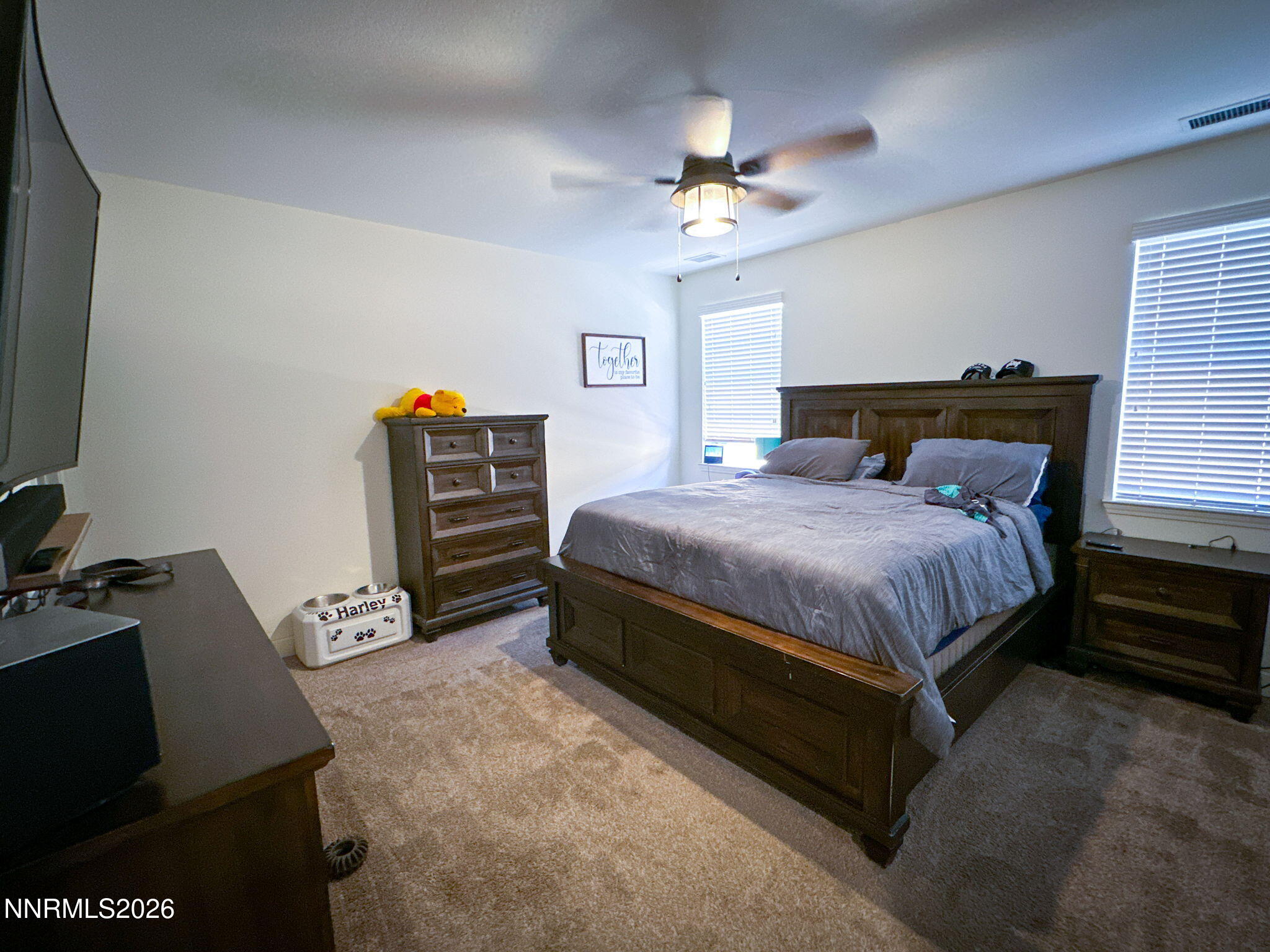 7330 Overture Drive Reno, NV 89506 - Photo 7 of 17 a bedroom with a bed and a chandelier