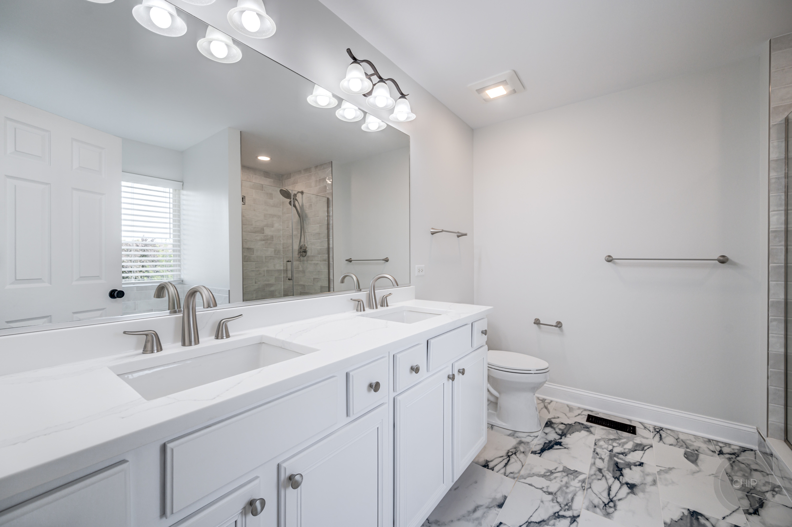 12948 Parterre Place Plainfield, IL 60585 - Photo 27 of 35 a bathroom with a sink a toilet a large mirror and vanity
