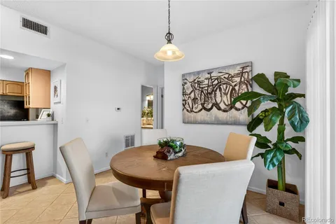 a kitchen with stainless steel appliances kitchen island granite countertop a refrigerator and microwave