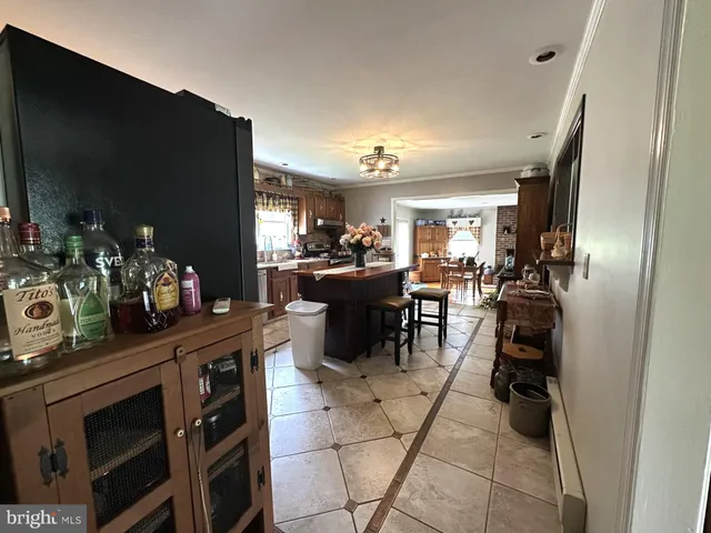 a kitchen with a sink stove top oven and cabinets