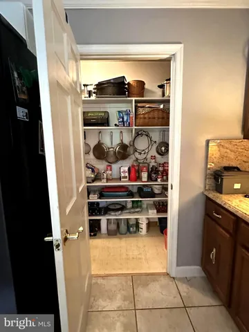 a kitchen with stainless steel appliances granite countertop a stove and a refrigerator