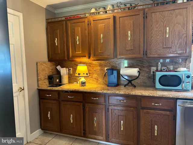 a kitchen with a dining table and chairs