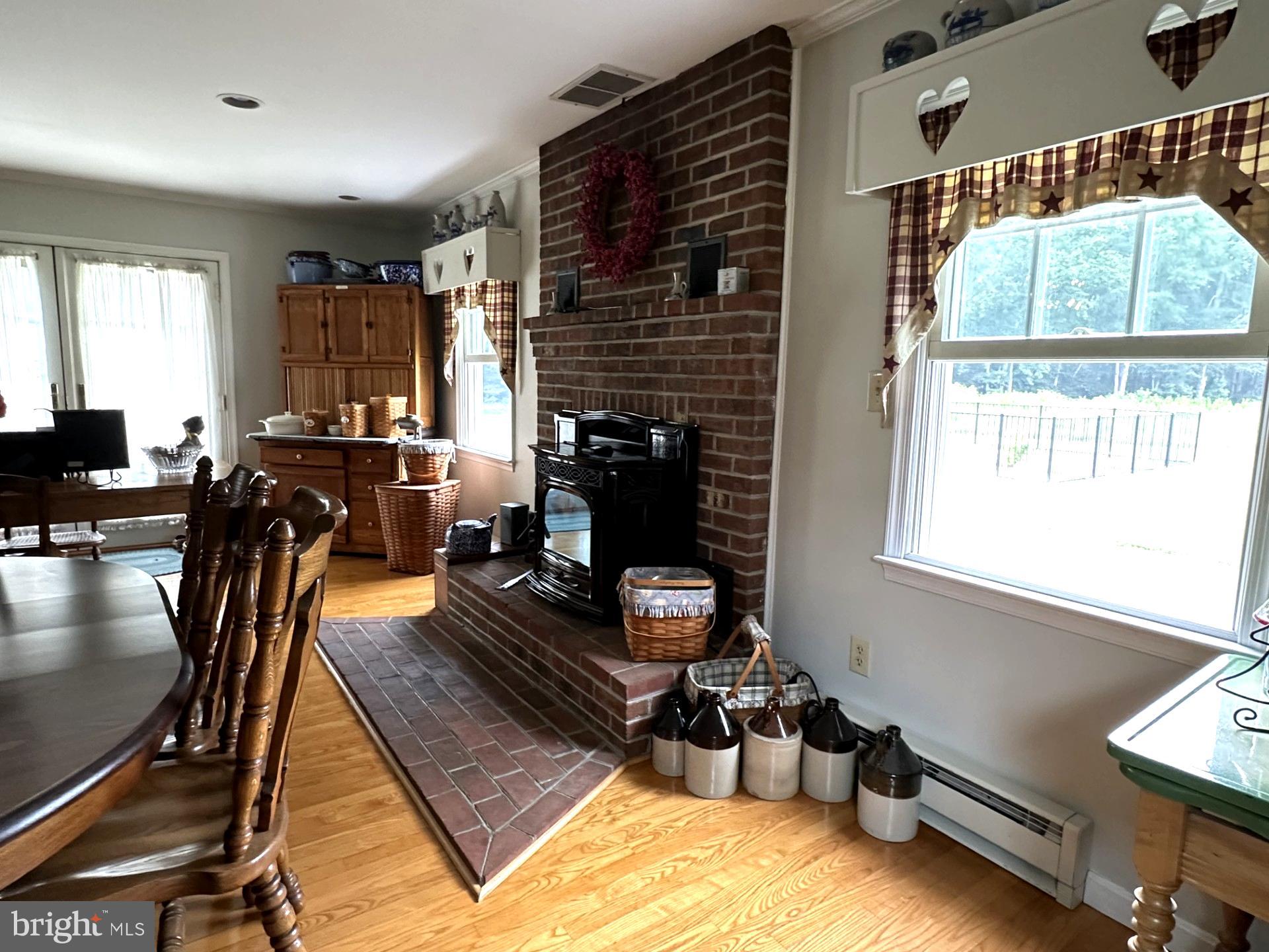 28402 Liden School Road Denton, MD 21629 - Photo 34 of 59 a living room with furniture a window and wooden floor