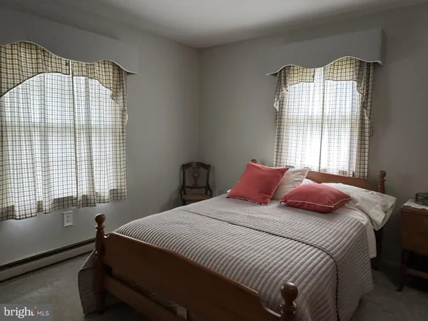 a close view of a utility room with dryer and washer