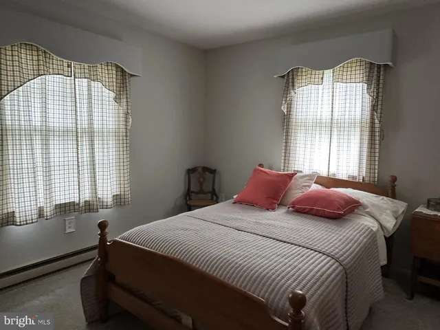 a close view of a utility room with dryer and washer