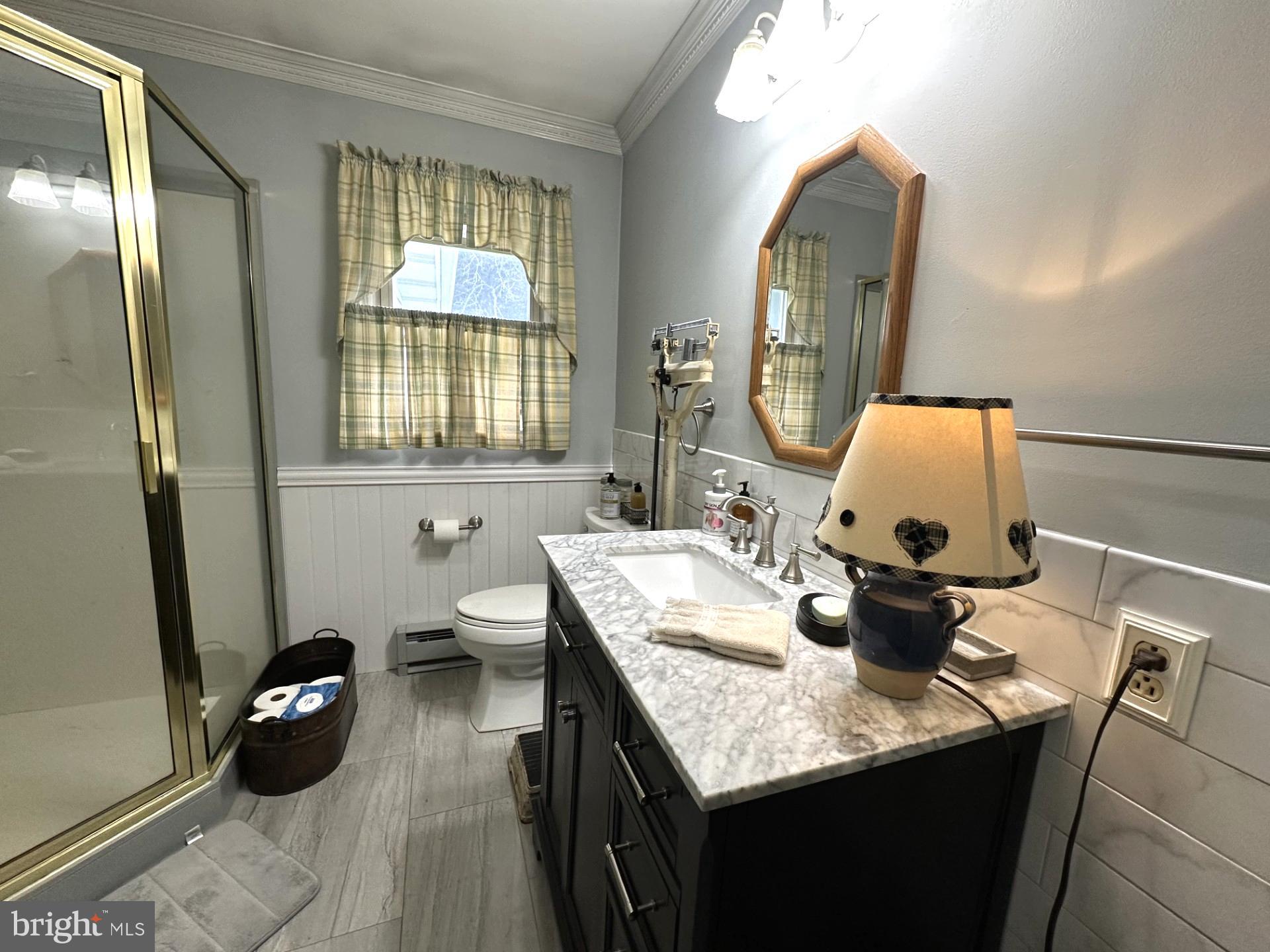 28402 Liden School Road Denton, MD 21629 - Photo 37 of 59 a bathroom with a granite countertop sink and a mirror