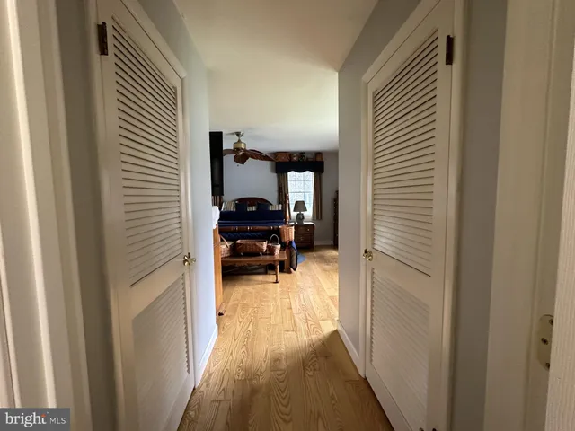 a view of swimming pool and trees in the background