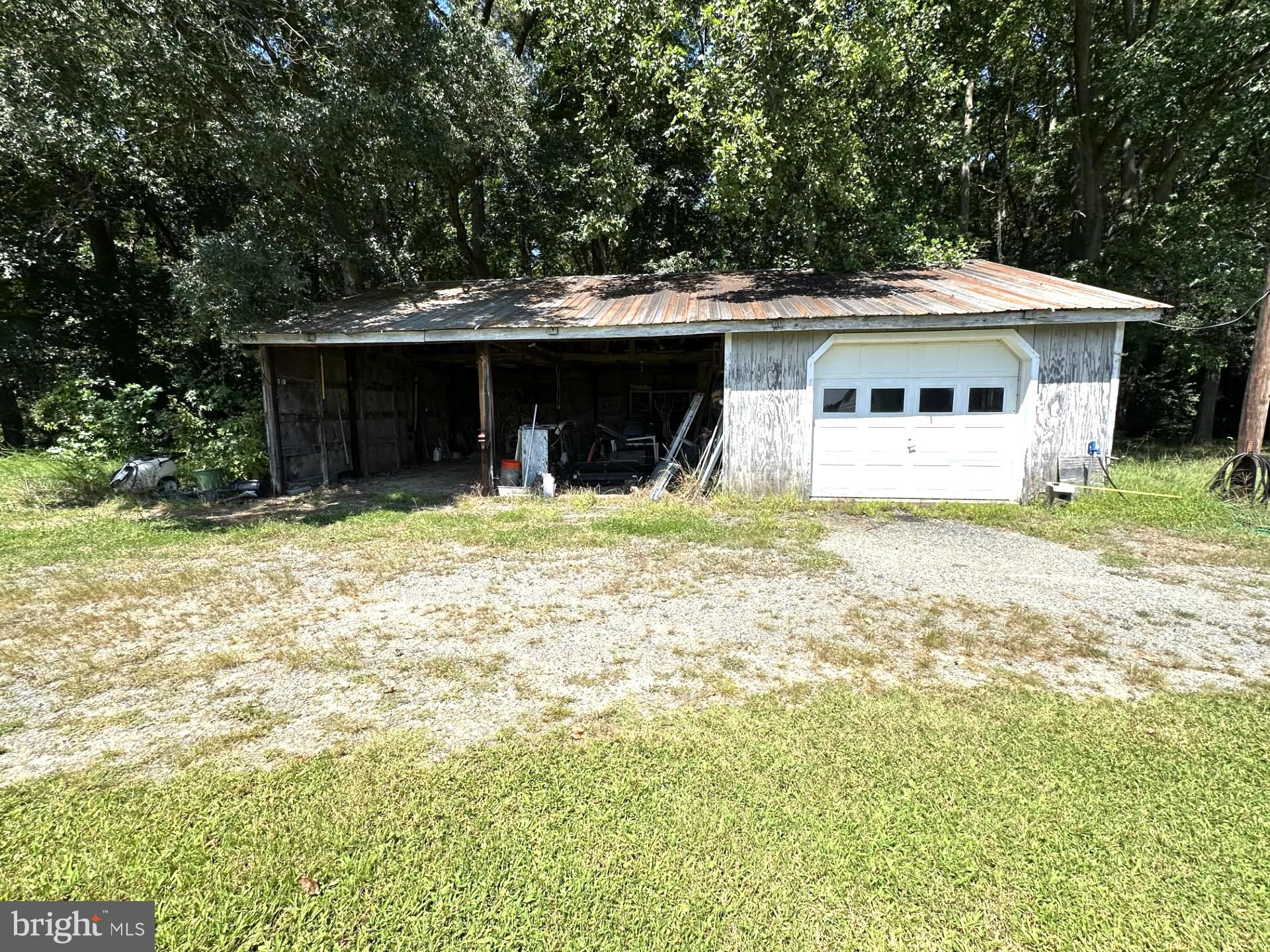 28402 Liden School Road Denton, MD 21629 - Photo 59 of 59 a front view of house with yard and trees in the background