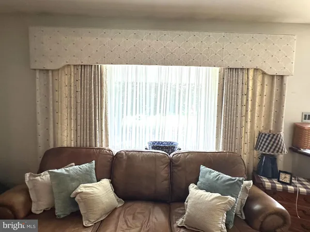 a living room with a couch and furniture