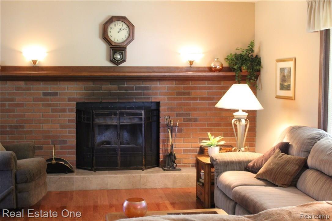 6474 Byron Road Howell, MI 48855 - Photo 23 of 62 FULL WALL BRICK FIREPLACE