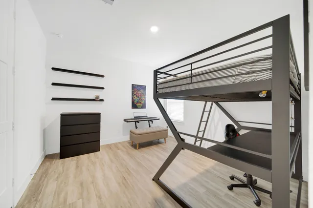 a view of a room with furniture and a window