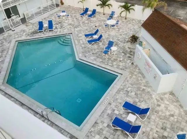 a view of living room with furniture and a fireplace