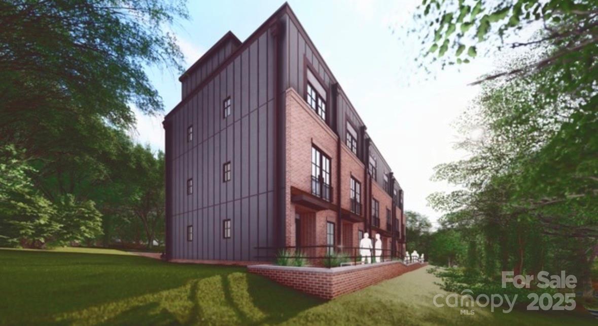 610 East 16th Street Charlotte, NC 28206 - Photo 2 of 4 a view of a tall building with a big yard and large trees