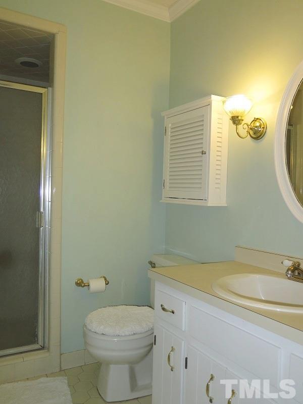 11501 Coachmans Way Raleigh, NC 27614 - Photo 11 of 20 a bathroom with a sink and a toilet