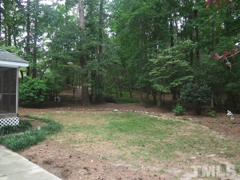 11501 Coachmans Way Raleigh, NC 27614 - Photo 20 of 20 a backyard of a house with lots of green space