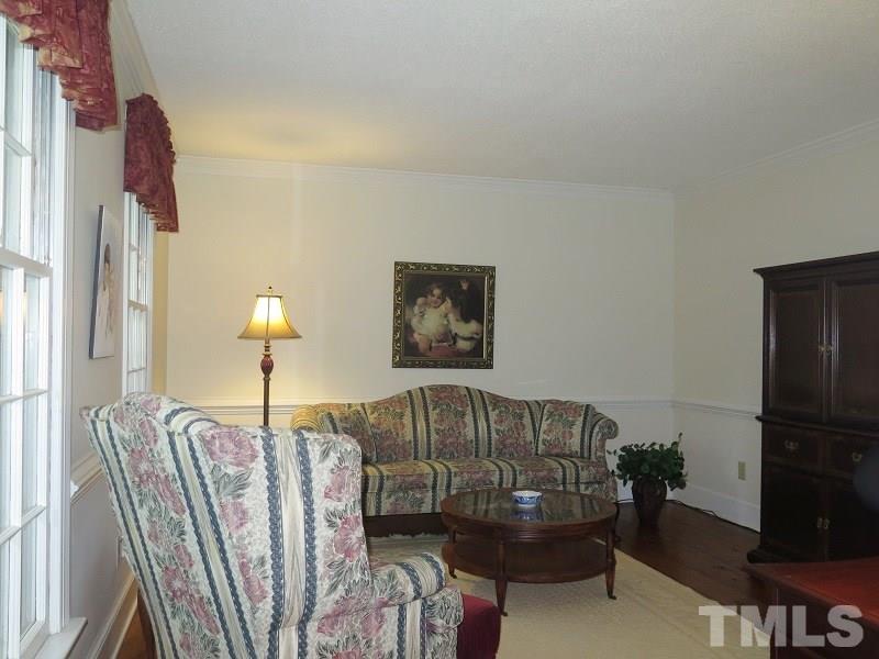 11501 Coachmans Way Raleigh, NC 27614 - Photo 3 of 20 a living room with furniture and a wooden floor