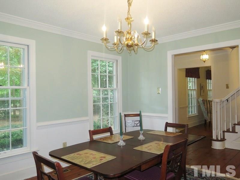 11501 Coachmans Way Raleigh, NC 27614 - Photo 4 of 20 a view of a dining room with furniture window and outside view