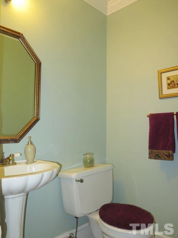 11501 Coachmans Way Raleigh, NC 27614 - Photo 9 of 20 a bathroom with a sink and a toilet