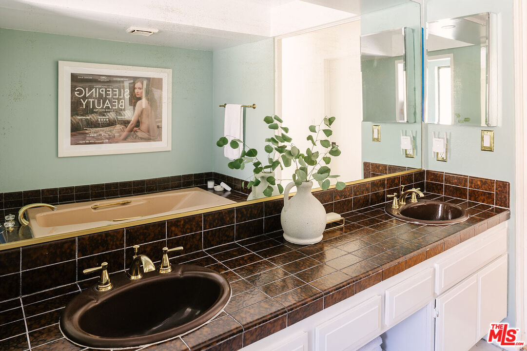 3122 Arrowhead Drive Los Angeles, CA 90068 - Photo 24 of 41 a bathroom with a sink and a mirror