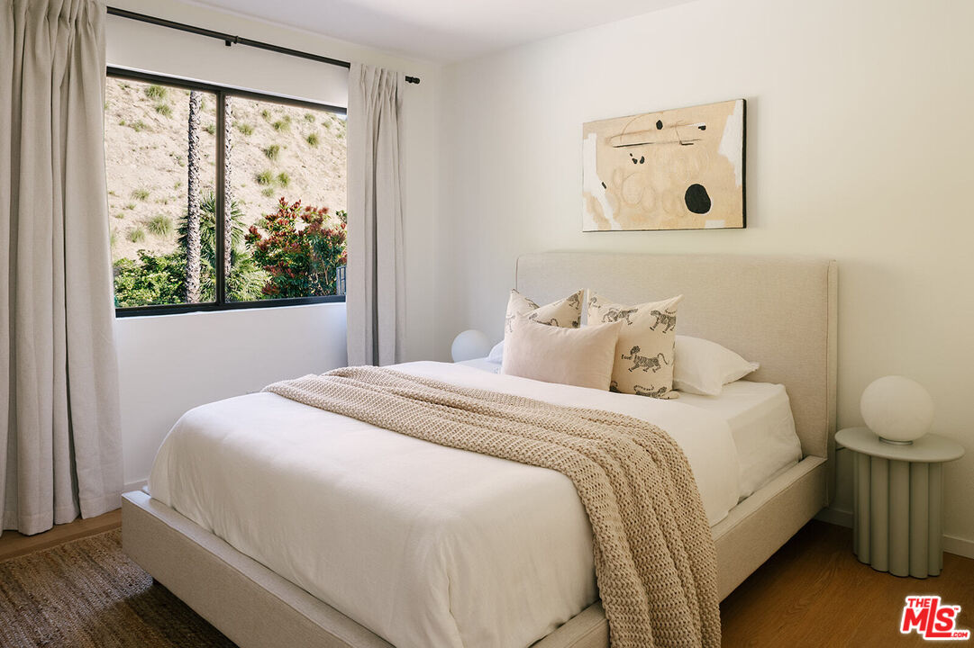 3122 Arrowhead Drive Los Angeles, CA 90068 - Photo 27 of 41 a bedroom with a bed and a window