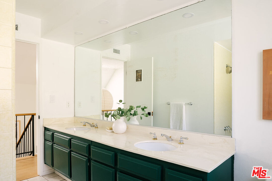 3122 Arrowhead Drive Los Angeles, CA 90068 - Photo 29 of 41 a bathroom with a sink and a mirror