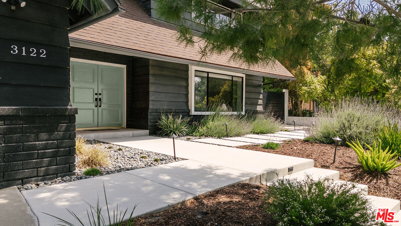 3122 Arrowhead Drive Los Angeles, CA 90068 - Photo 3 of 41 a front view of a house with a garden