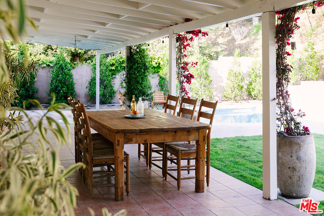 3122 Arrowhead Drive Los Angeles, CA 90068 - Photo 36 of 41 a view of an outdoor dining space with a table and chairs