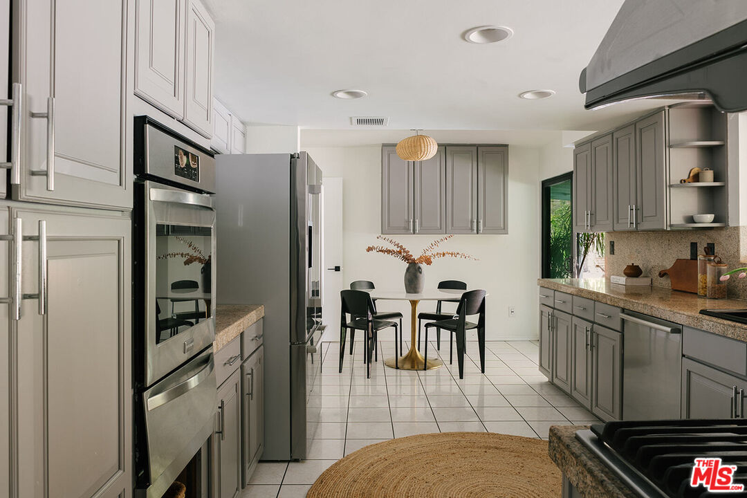 3122 Arrowhead Drive Los Angeles, CA 90068 - Photo 8 of 41 a kitchen with stainless steel appliances granite countertop a refrigerator and a stove top oven