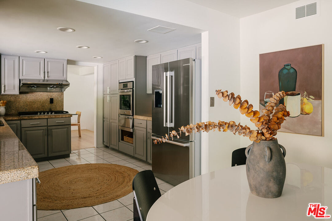 3122 Arrowhead Drive Los Angeles, CA 90068 - Photo 9 of 41 a kitchen with stainless steel appliances granite countertop a refrigerator and a stove