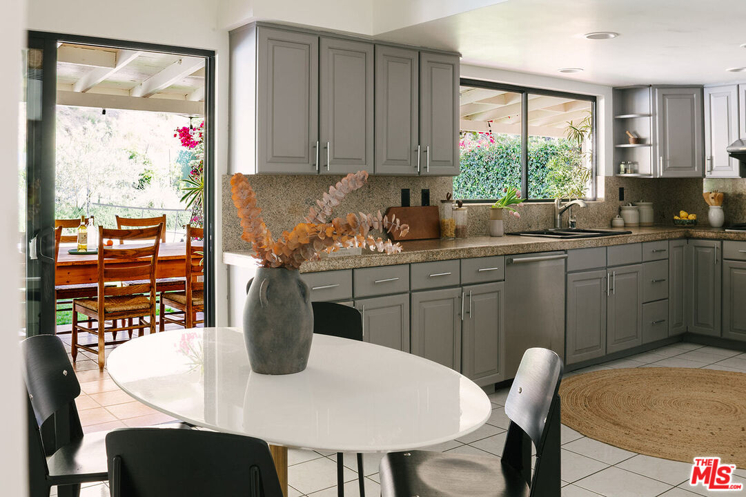3122 Arrowhead Drive Los Angeles, CA 90068 - Photo 10 of 41 a kitchen with a table chairs sink and cabinets