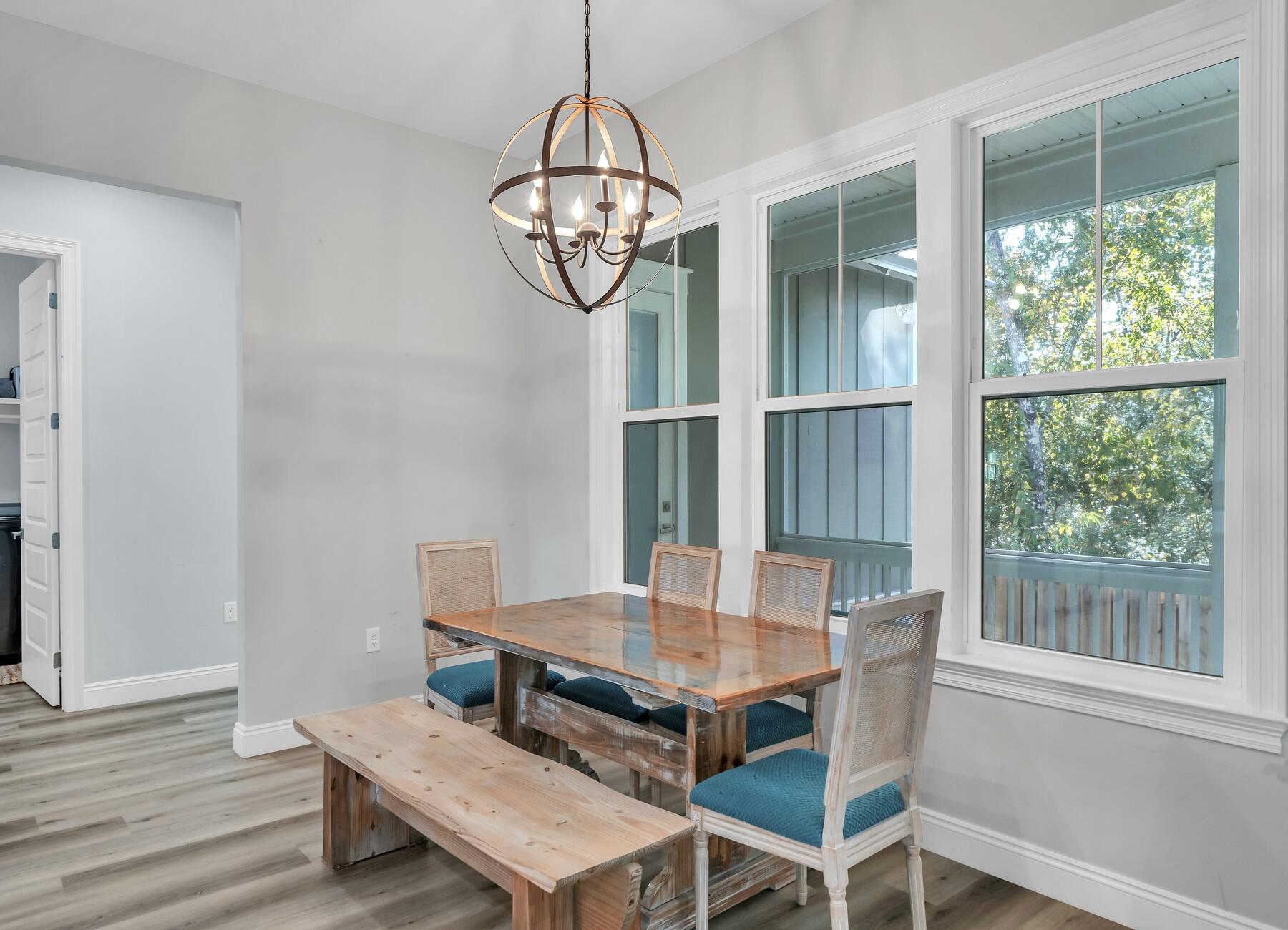 15 Hibernate Way Freeport, FL 32439 - Photo 12 of 38 a view of a dining room with furniture window and wooden floor