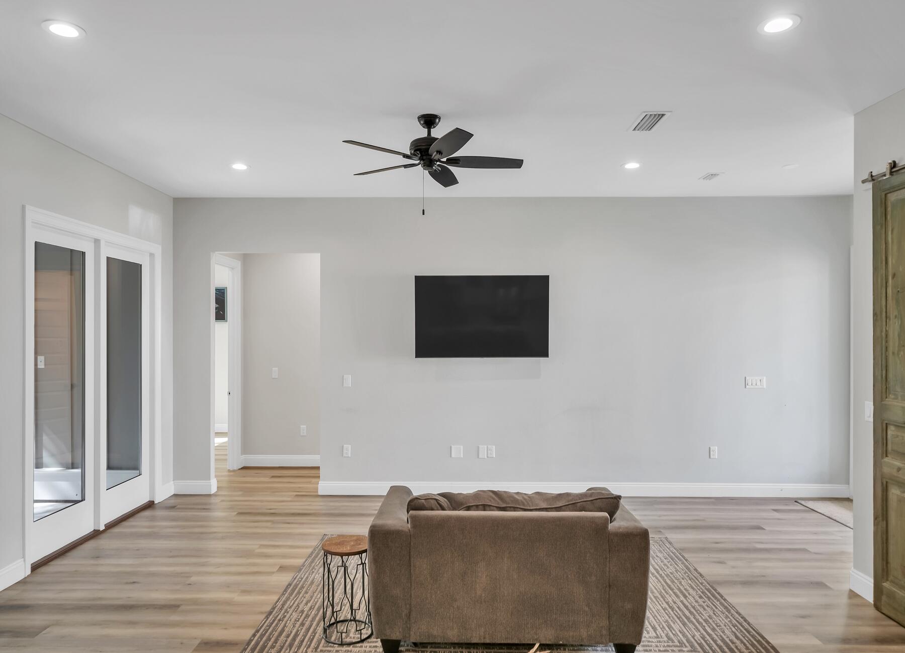 15 Hibernate Way Freeport, FL 32439 - Photo 13 of 38 a living room with furniture and a flat screen tv