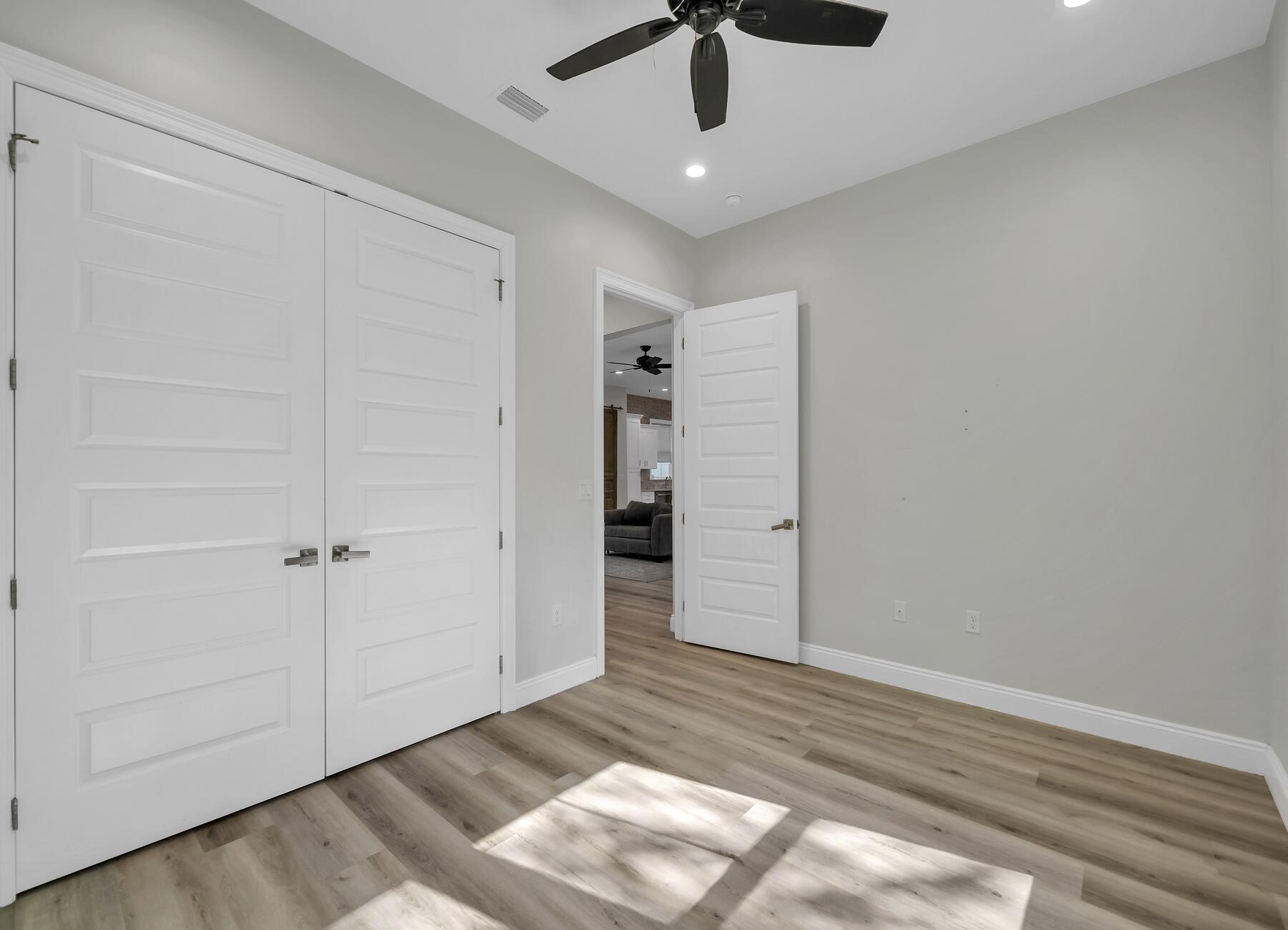 15 Hibernate Way Freeport, FL 32439 - Photo 27 of 38 an empty room with an entryway and chandelier