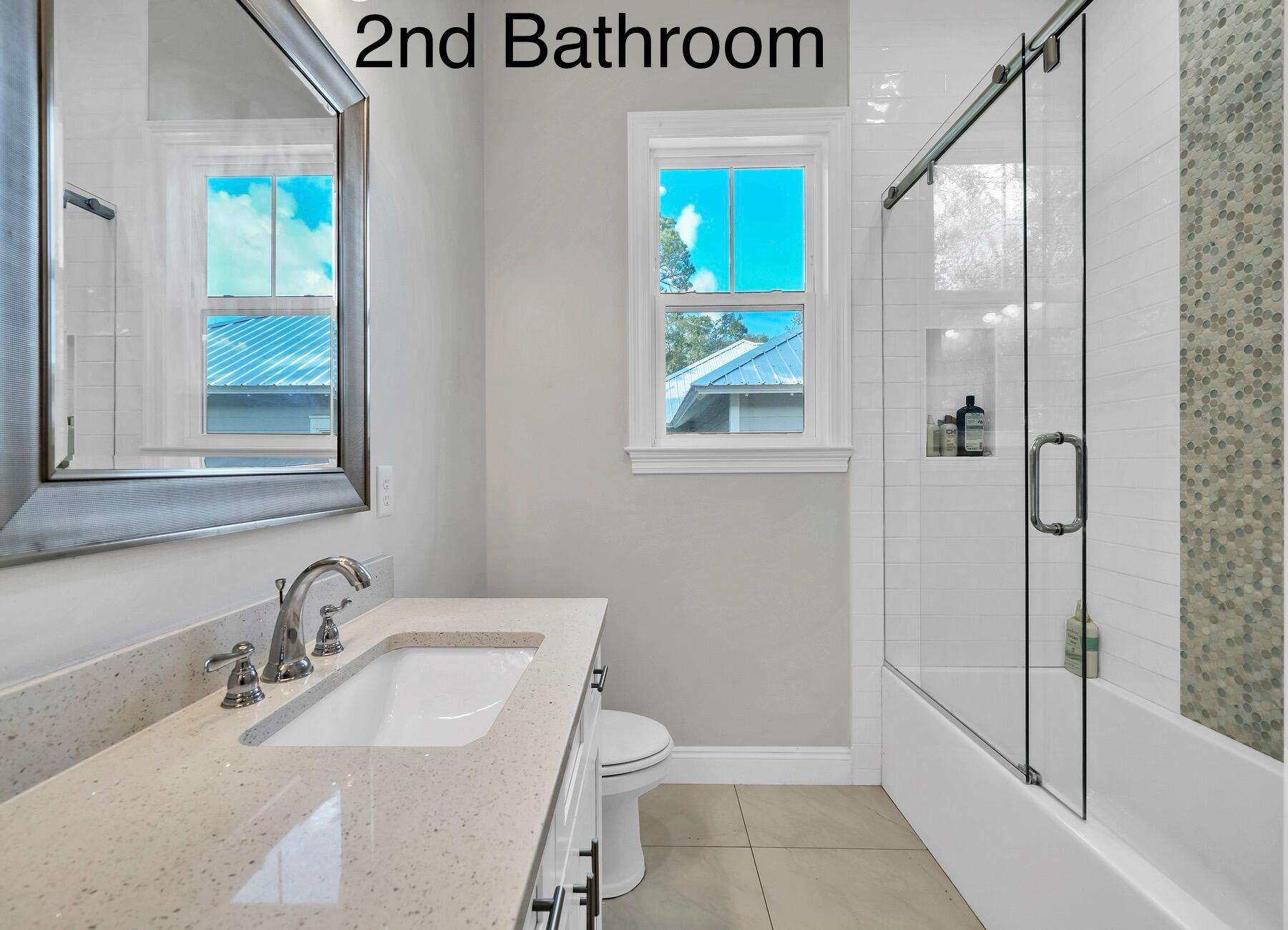 15 Hibernate Way Freeport, FL 32439 - Photo 31 of 38 a bathroom with a sink a toilet and shower