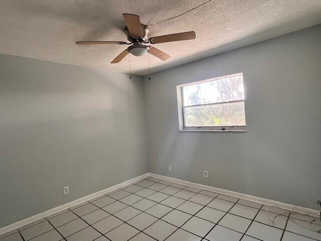 1798 Northwest 15th Vista, Unit 5 Boca Raton, FL 33432 - Photo 11 of 15 an empty room with windows and fan
