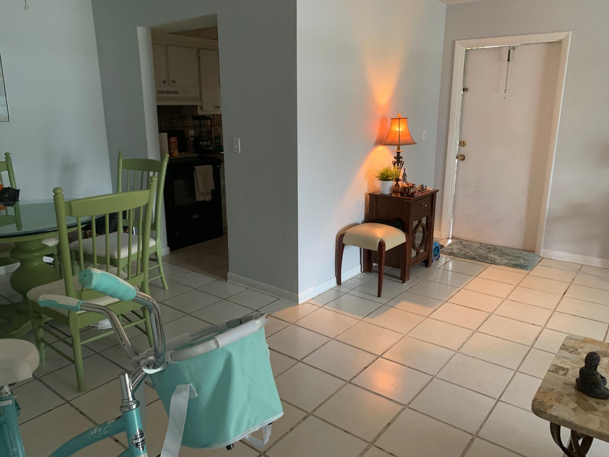 1798 Northwest 15th Vista, Unit 5 Boca Raton, FL 33432 - Photo 14 of 15 a living room with a rug