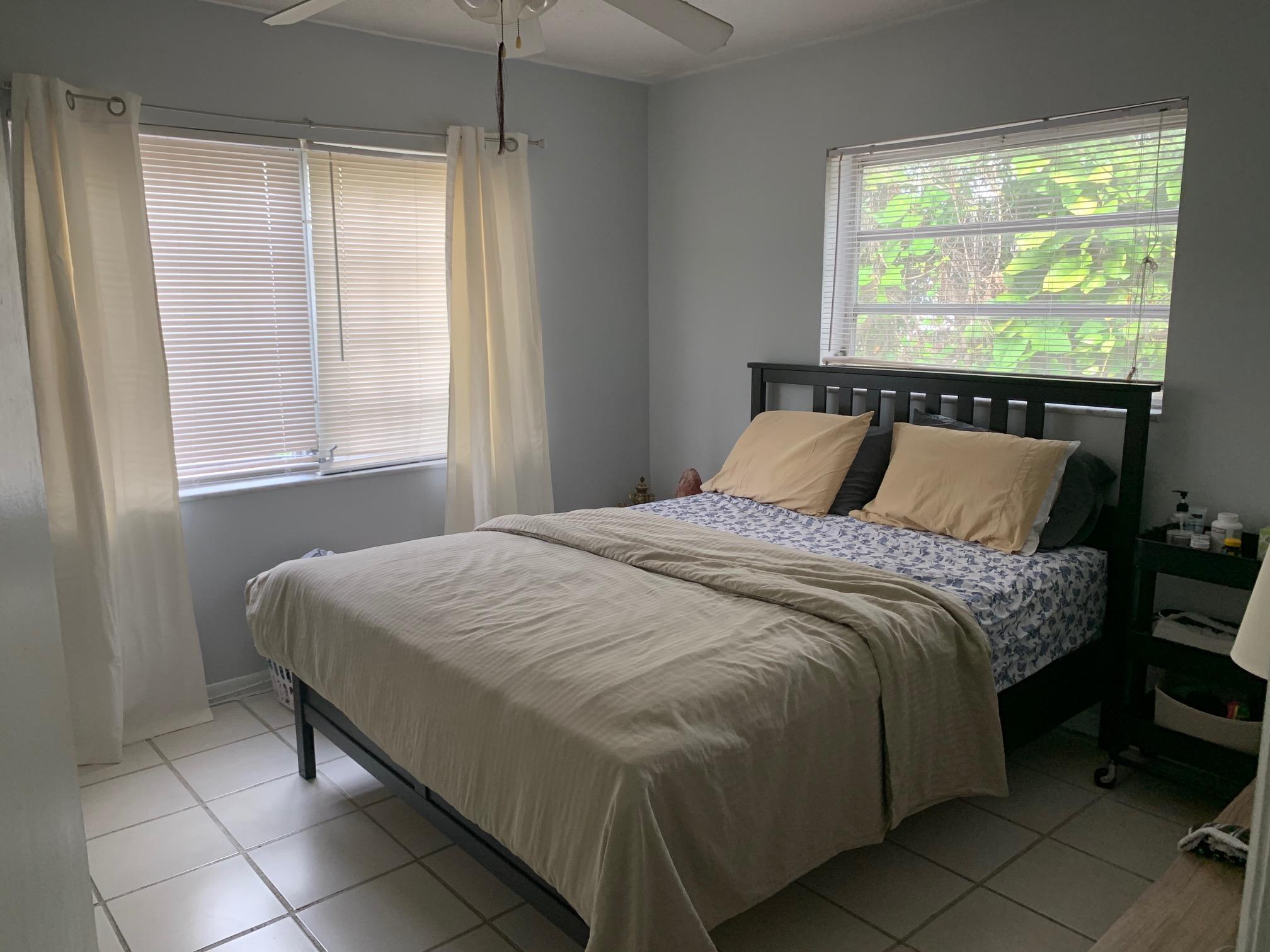 1798 Northwest 15th Vista, Unit 5 Boca Raton, FL 33432 - Photo 15 of 15 a bedroom with a bed and a window