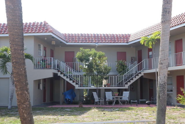 1798 Northwest 15th Vista, Unit 5 Boca Raton, FL 33432 - Photo 2 of 15 a view of house with swimming pool and porch with furniture
