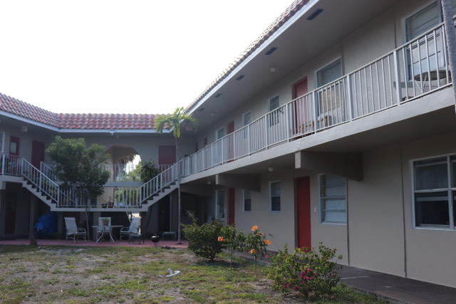 1798 Northwest 15th Vista, Unit 5 Boca Raton, FL 33432 - Photo 3 of 15 a view of a house with many windows